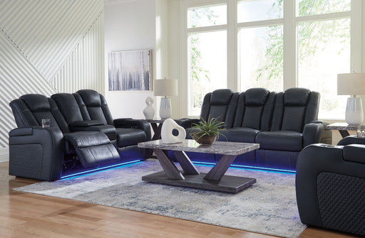 Signature Design by Ashley reclining living room set with plush sofas and loveseats, featuring padded armrests and reclining mechanisms.