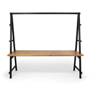 Noble House Huckleberry acacia wood outdoor dining table with built-in plant hanger, teak finish, sturdy and stylish for outdoor dining.