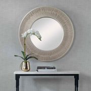 Round wall mirror with a sailor's knot design, by Uttermost, featuring a nautical-inspired decorative frame.