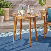 Noble House Stamford modern outdoor bistro table with water-resistant teak finish, ideal for patio or garden dining.