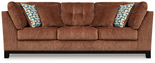 Ashley® Laylabrook plush upholstered sofa with dark wood trim, bold spice color, in a stylish living room setting.