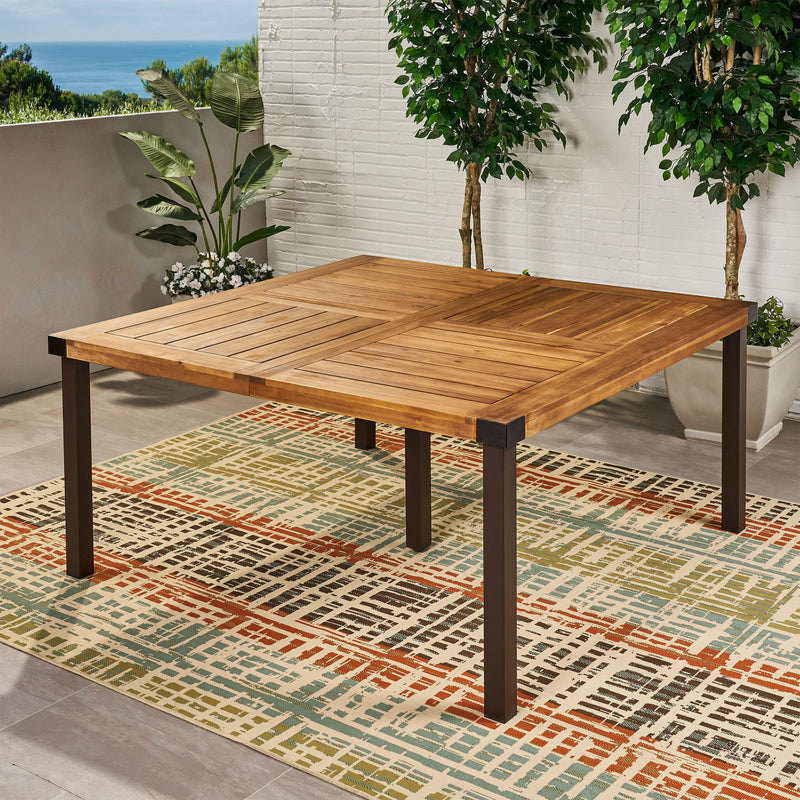 Modern industrial dining table with acacia wood slats in teak finish, by Noble House, showcasing sleek design and sturdy construction.