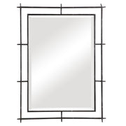 Black industrial wall mirror by Uttermost with a sturdy metal frame, ideal for modern or industrial interior decor.