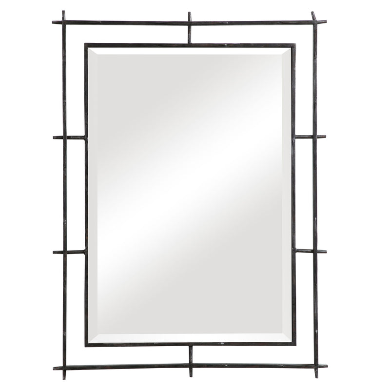 Black industrial wall mirror by Uttermost with a sturdy metal frame, ideal for modern or industrial interior decor.