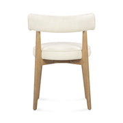 TOV Furniture Nikita dining side chair with modern design, upholstered seat and sleek wooden legs, ideal for contemporary dining spaces.