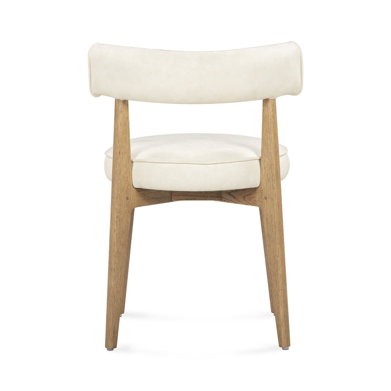 TOV Furniture Nikita dining side chair with modern design, upholstered seat and sleek wooden legs, ideal for contemporary dining spaces.