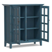 Medium handcrafted Acadian accent storage cabinet by Simpli-Home with doors and drawers, made of warm wood finish.