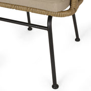 Noble House Randy modern wicker arm chair with brown frame and beige water-resistant cushions, stylish indoor or outdoor seating.