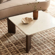 Cream square coffee table by TOV Furniture with a modern design, featuring a smooth surface and sturdy legs.