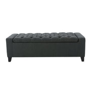 Dark gray Noble House storage ottoman with tufted top, showcasing a contemporary design and soft fabric upholstery.