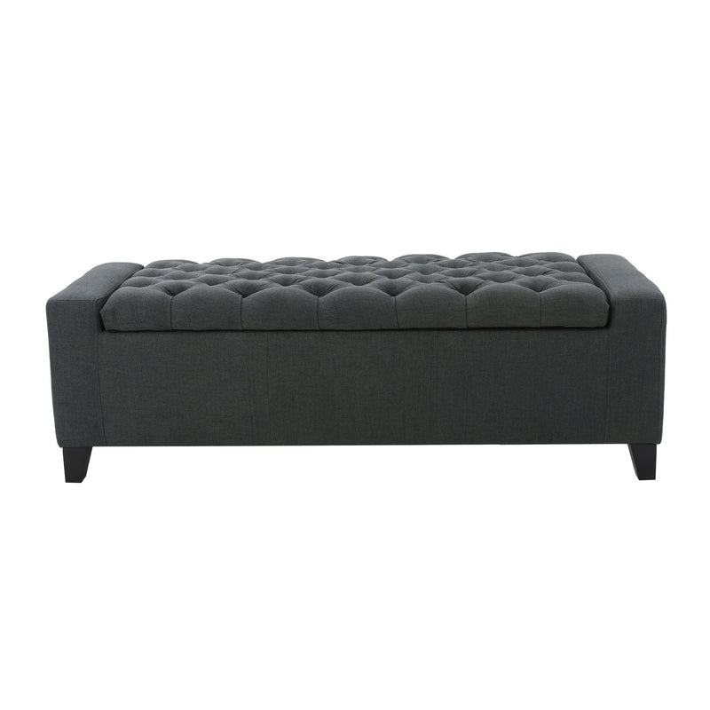 Dark gray Noble House storage ottoman with tufted top, showcasing a contemporary design and soft fabric upholstery.