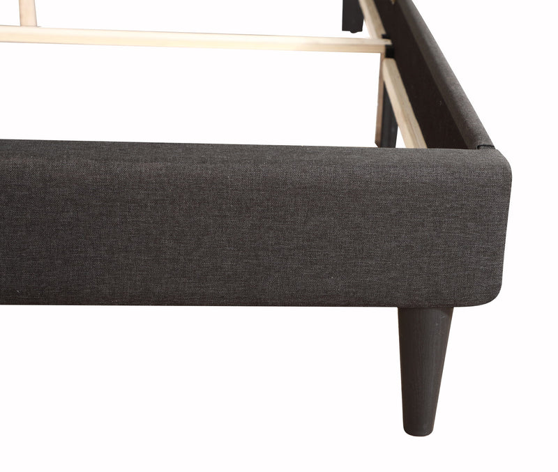 Button tufted upholstered bed by Glory Furniture, showcasing a cozy, elegant design with plush fabric and tufted headboard.