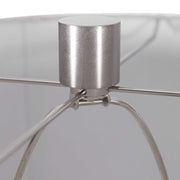Light brown ceramic table lamp by Uttermost featuring a sleek, rounded design suitable for living rooms or bedrooms.
