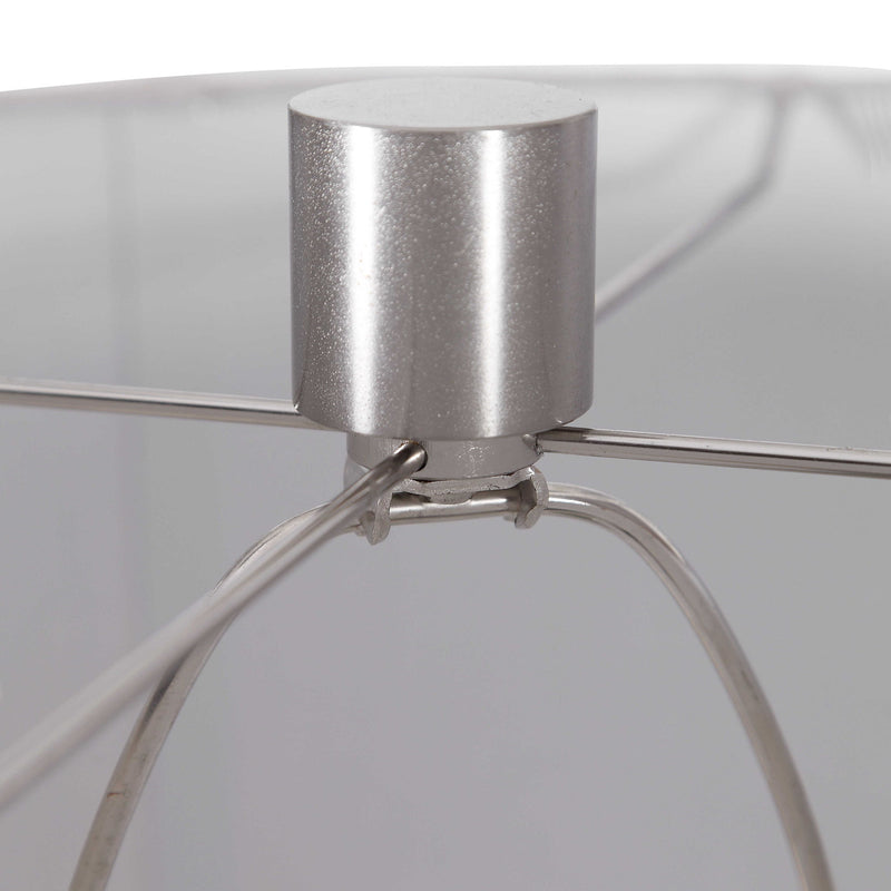 Light brown ceramic table lamp by Uttermost featuring a sleek, rounded design suitable for living rooms or bedrooms.