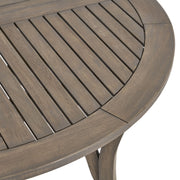 Noble House Hermosa outdoor acacia wood circular dining table with sturdy design and natural wood finish.