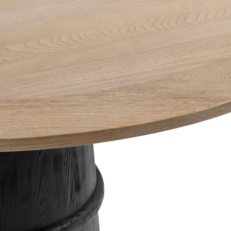Lunen 55-inch round dining table by Classic Home with Soft Reef Noir finish, featuring a smooth tabletop and sturdy base.