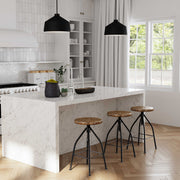 Uttermost Holgate black 1-light pendant lighting fixture with sleek, modern design hanging from a ceiling.