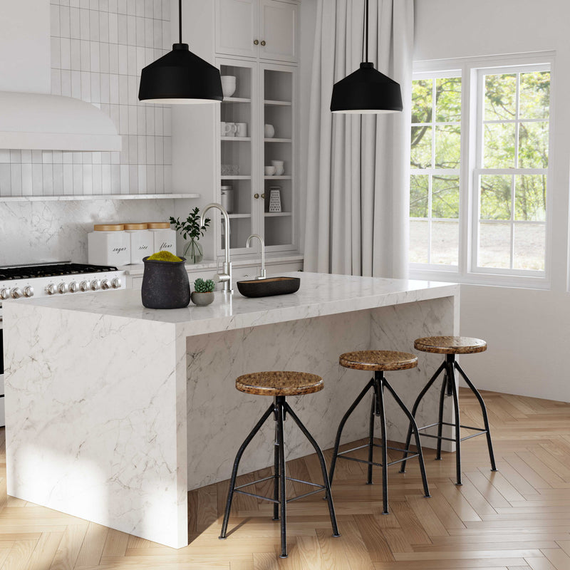 Uttermost Holgate black 1-light pendant lighting fixture with sleek, modern design hanging from a ceiling.