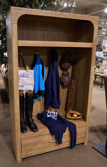 Brown Dovander hall tree with storage bench by Signature Design Ashley®, featuring hooks and a cushioned seating area.