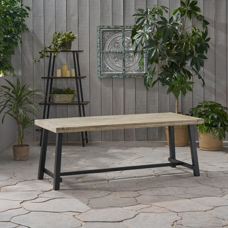 Noble House Equilibrium outdoor dining table with wooden frame and slat top, perfect for garden or patio dining areas.