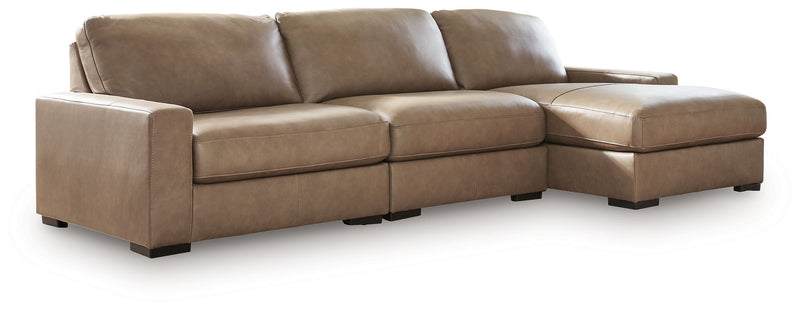 Benchcraft Veronella stationary sectional sofa with plush fabric and modern design, shown in a spacious living room setting.