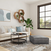 Large square coffee table pouf by Simpli-Home, Brody accent pouf with plush fabric and modern design for versatile seating or decor.