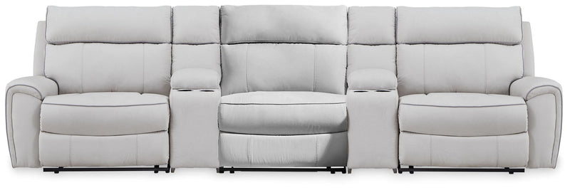 Signature Design by Ashley reclining sectional sofa with plush cushions and modern design, perfect for comfortable living rooms.