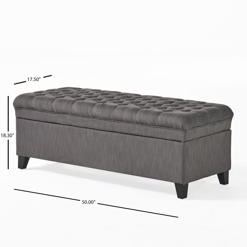 Noble House Juliana storage ottoman with beige fabric, wooden birch legs, and a cushioned top for versatile seating and storage.