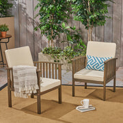 Pair of Noble House Casa Acacia wood club chairs with gray and cream water-resistant cushions, perfect for outdoor seating.