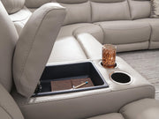 Benchcraft® Gravier reclining sectional sofa with plush cushions and reclining features, shown in a modern living room setting.