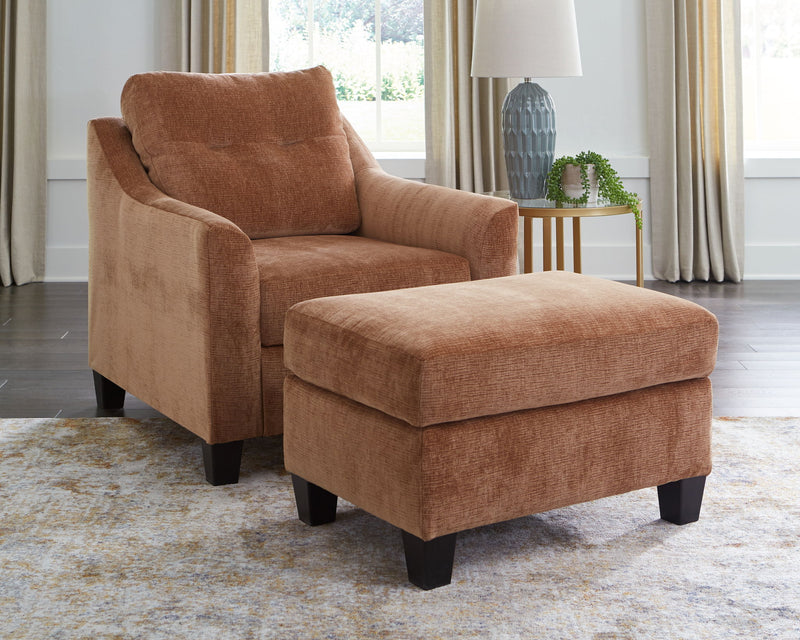 Benchcraft® Amity Bay 3-piece living room set with sofa, loveseat, and armchair in a cozy, modern living space.