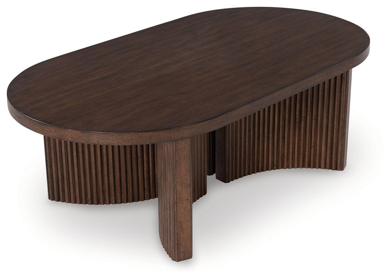 Korestone - Oval Cocktail Table - Dark Brown - R&R Furniture Gallery (Fountain Valley, CA)
