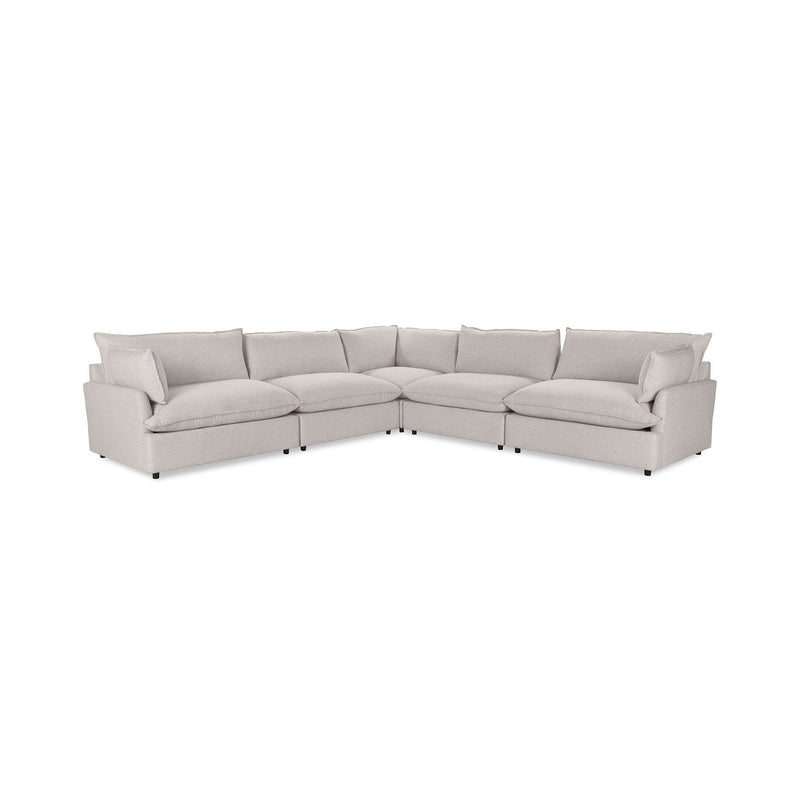 Classic Home Caplan modular sectional sofa with beige upholstery and plush cushions in a modern living room setting.