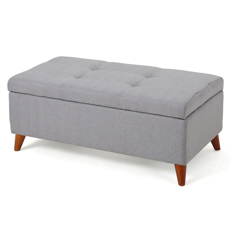Light gray upholstered storage ottoman with button-tufted seat and lift-top, featuring a soft fabric finish from Noble House.