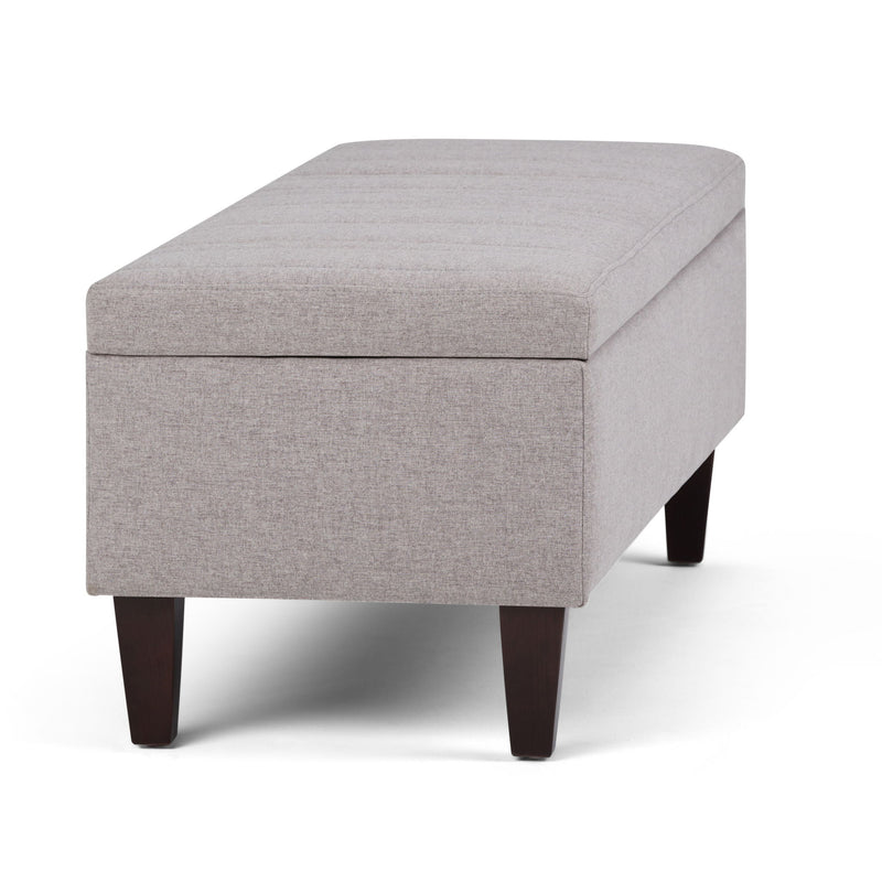 Simpli-Home Monroe upholstered storage ottoman with cushioned top and spacious interior for versatile living room storage.
