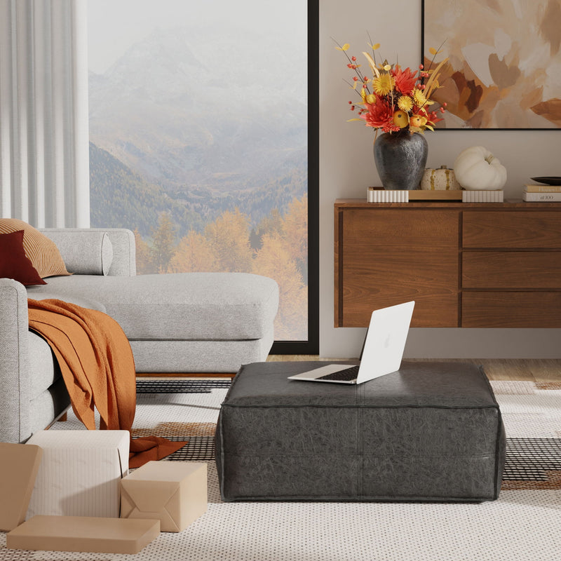 Large square coffee table pouf from Simpli-Home's Brody accent poufs collection, showing soft fabric upholstery and plush cushioning.