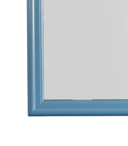 Glory Furniture traditional wall mirror with a classic frame, suitable for any space, reflecting a modern interior setting.