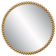 Uttermost Byzantine round wall mirror with a gold finish, featuring an ornate, decorative frame for elegant wall decor.