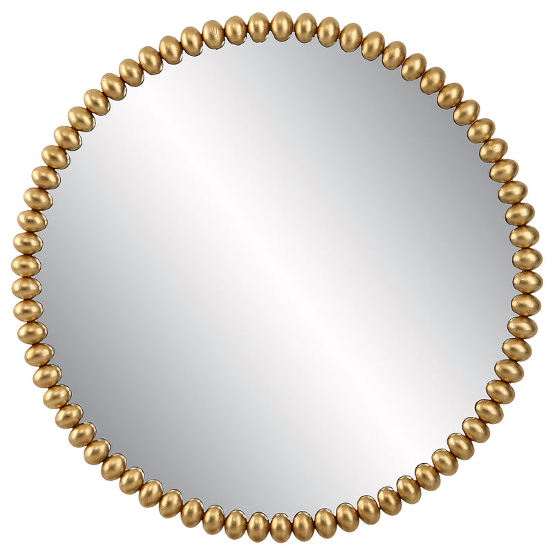 Uttermost Byzantine round wall mirror with a gold finish, featuring an ornate, decorative frame for elegant wall decor.