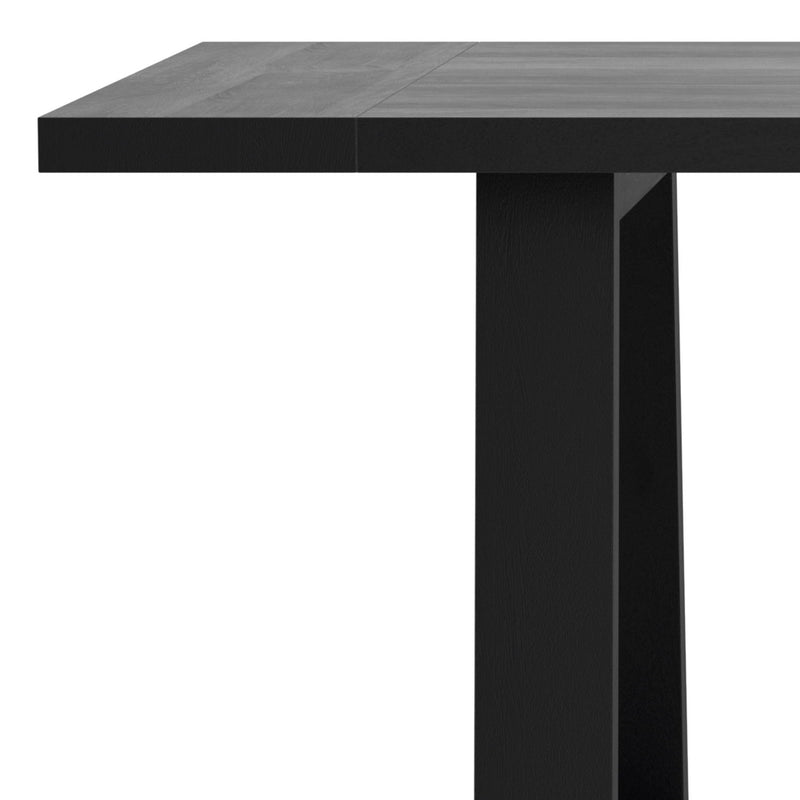Simpli-Home Whitley dining table with wooden surface and sturdy legs, ideal for modern dining room setups.