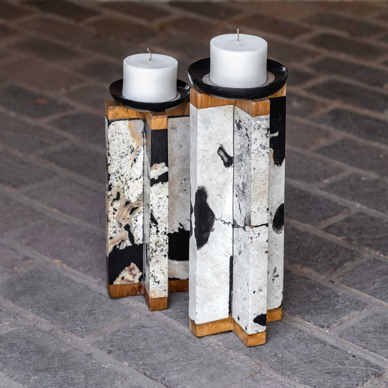 Set of two Illini stone candleholders by Uttermost in black and white, featuring a modern, textured design for decorative candle display.