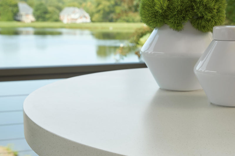 Seton Creek round bar table with beige finish and umbrella hole, by Signature Design by Ashley, outdoor patio furniture.