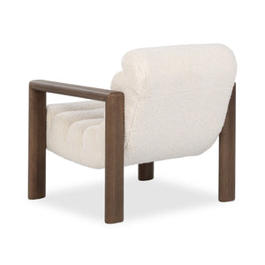 Classic Home Dahlia accent chair with plush upholstery and wooden legs, showcasing a stylish and comfortable seating option.