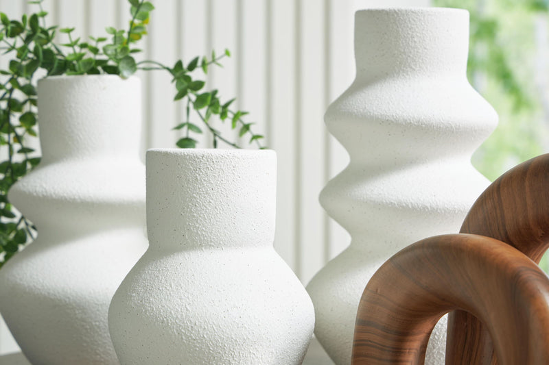 Set of five white and brown table accessories from Carterworth by Signature Design Ashley, including decorative pieces and functional items.