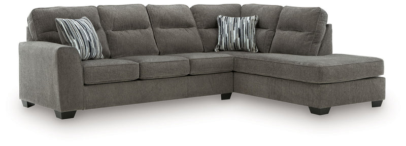 Benchcraft Olten stationary sectional sofa with plush cushions and modern design, perfect for contemporary living rooms.