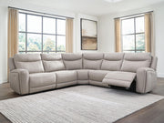 Benchcraft® Gravier reclining sectional sofa with plush cushions and reclining features, shown in a living room setting.