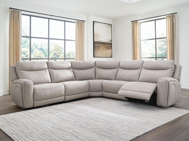 Benchcraft® Gravier reclining sectional sofa with plush cushions and reclining features, shown in a living room setting.