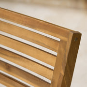 Outdoor Hermosa 5-piece wood dining set with cushions, teak finish and beige cushions, by Noble House.