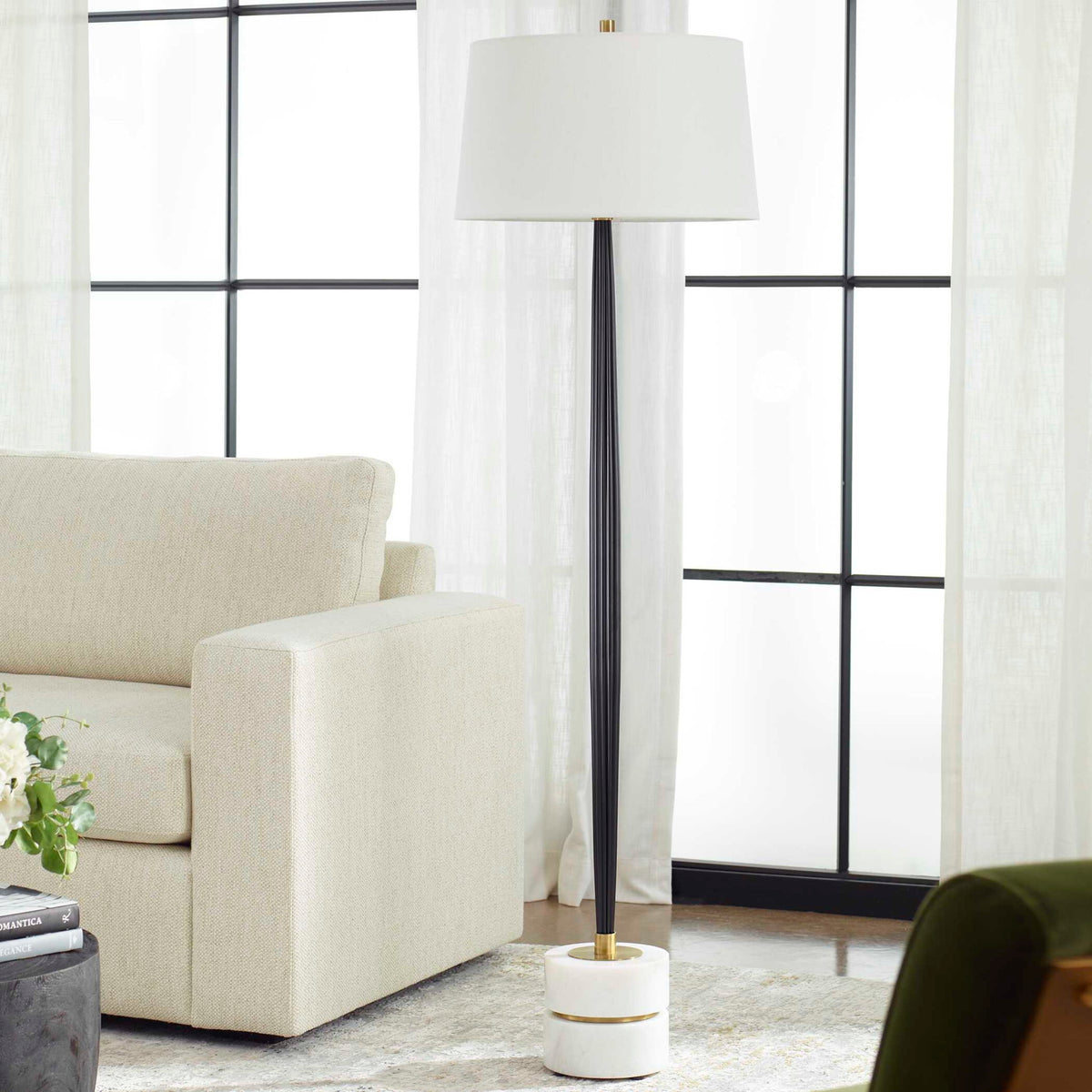 Uttermost Miraz black floor lamp with sleek modern design, featuring a slim stand and a cylindrical lampshade.