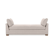 Classic Home Audrey daybed with a wooden frame and upholstered cushions, showcased in a cozy living space.